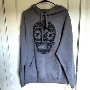 Cozy gray hoodie with bold black sugar skull graphic — purchased in Baja